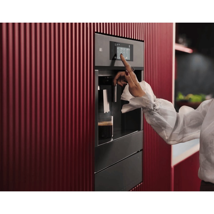 Built-in coffee machine designed to fit flush with kitchen cabinetry for a streamlined look.
