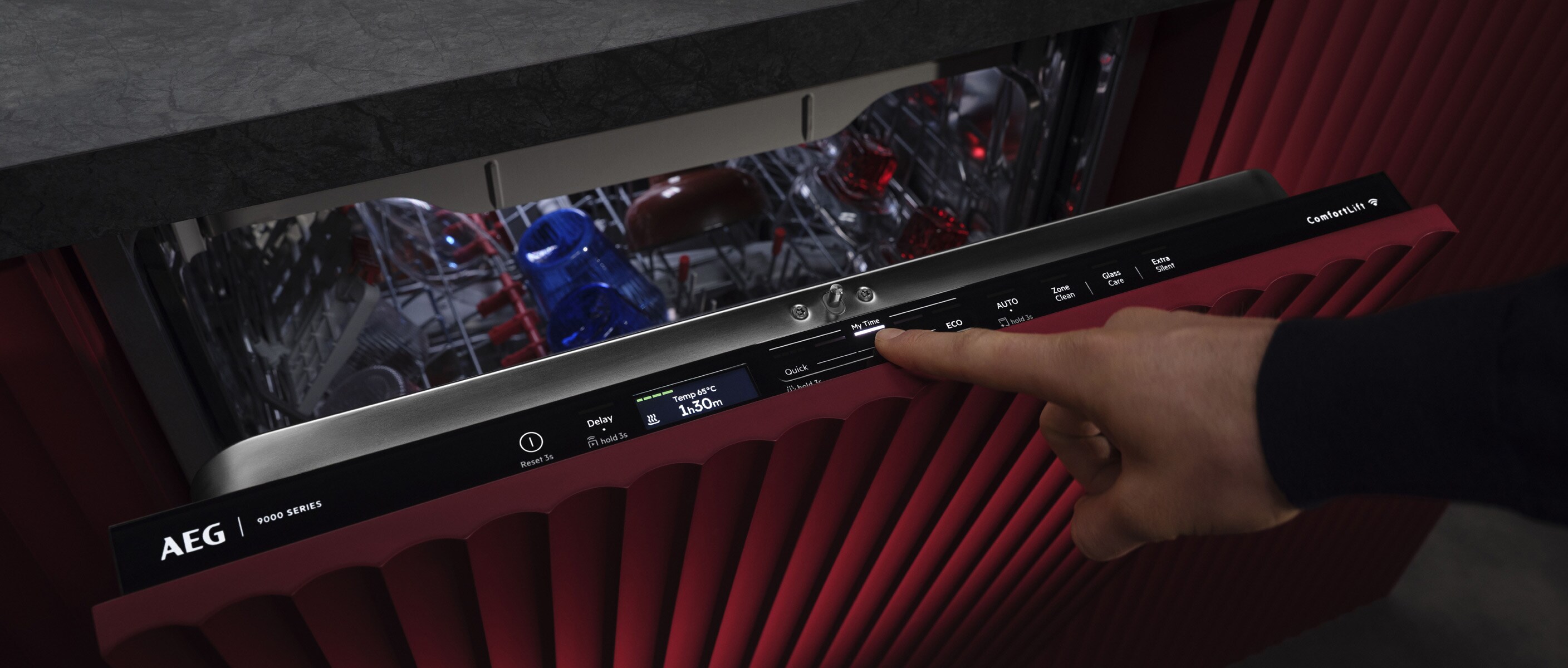 Woman adjusting slider on the dishwasher control panel