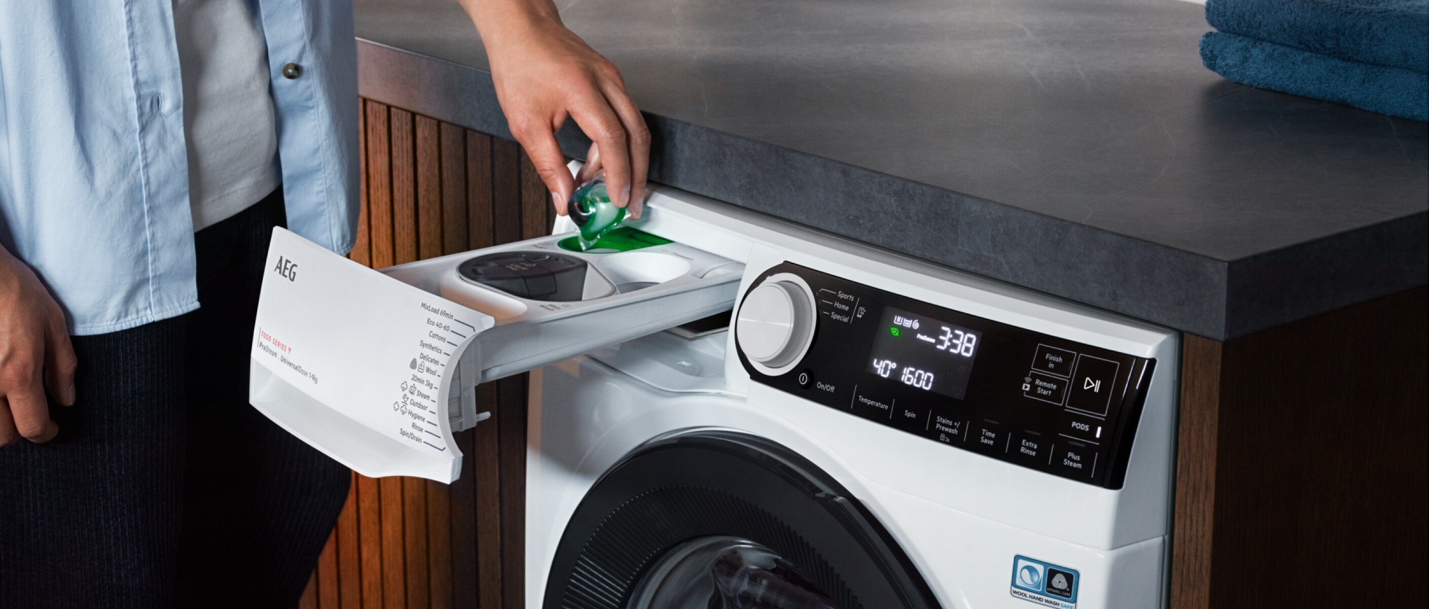 Man adding detergent to washing machine