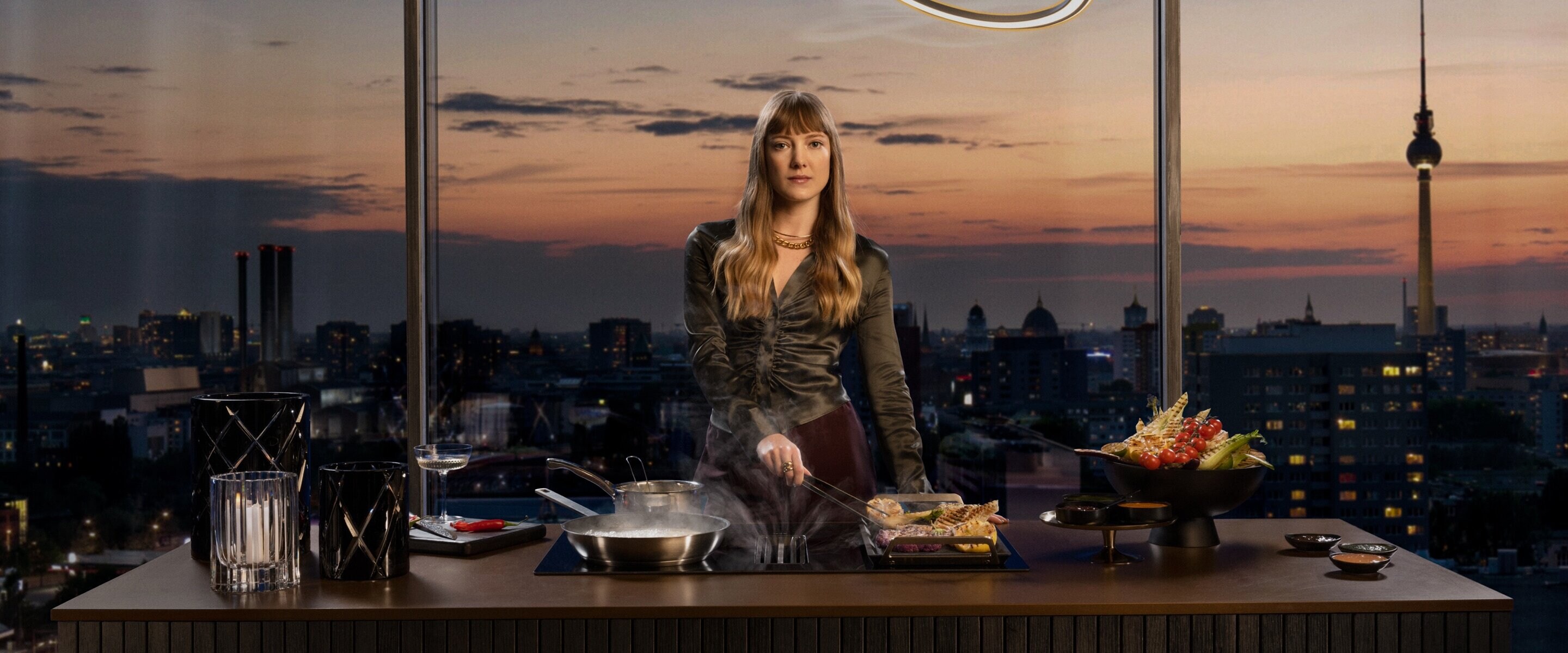 Woman cooking on hob